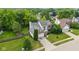 Aerial view of a lovely home with a spacious yard and mature trees in a desirable neighborhood at 14492 Cotswold Ln, Carmel, IN 46033
