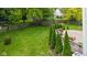 Lush backyard featuring a well-maintained lawn, privacy fence, and mature trees, creating a serene outdoor oasis at 14492 Cotswold Ln, Carmel, IN 46033