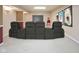 This finished basement features movie theater seating, a projector screen, and recessed lighting, ideal for entertainment at 14492 Cotswold Ln, Carmel, IN 46033