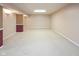 The spacious finished basement is carpeted and has neutral colored walls with accents, offering a versatile living space at 14492 Cotswold Ln, Carmel, IN 46033