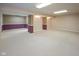 This spacious finished basement has neutral walls with accent colors and carpeting, perfect for versatile use and comfort at 14492 Cotswold Ln, Carmel, IN 46033