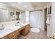 Bright bathroom with a double vanity, and a shower tub combination, perfect for relaxation at 14492 Cotswold Ln, Carmel, IN 46033