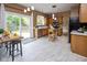 Updated kitchen with stainless steel appliances, a mobile island, and backyard access at 14492 Cotswold Ln, Carmel, IN 46033