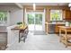 Bright kitchen featuring breakfast bar, stainless appliances, and view to backyard at 14492 Cotswold Ln, Carmel, IN 46033