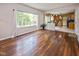 Open floor plan showcasing the living room with hardwood floors connecting to the kitchen at 14492 Cotswold Ln, Carmel, IN 46033