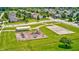Aerial view of a playground and basketball court surrounded by beautiful houses at 15178 Silver Charm Dr, Noblesville, IN 46060