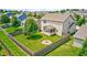 A spacious fenced backyard with a lush lawn and a circular fire pit area perfect for outdoor entertaining at 15178 Silver Charm Dr, Noblesville, IN 46060