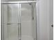 Enclosed shower space featuring sliding glass doors and modern shower head at 15178 Silver Charm Dr, Noblesville, IN 46060