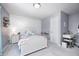 Bright bedroom features shiplap accent wall, perfect for a room or guest space at 15178 Silver Charm Dr, Noblesville, IN 46060