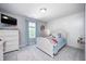 Cozy bedroom with a large window, natural light, and soft color palette, perfect for relaxing and unwinding at 15178 Silver Charm Dr, Noblesville, IN 46060