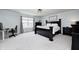 Serene bedroom retreat with elegant dark furniture, ample natural light, and a peaceful ambiance at 15178 Silver Charm Dr, Noblesville, IN 46060