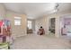Versatile bonus room with plush carpeting, ample space, and natural light from the windows at 15178 Silver Charm Dr, Noblesville, IN 46060