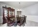 Traditional dining room featuring a dark wood table and china cabinet at 15178 Silver Charm Dr, Noblesville, IN 46060