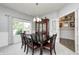 Dining room features a chandelier, table with seating for six, and a large window at 15178 Silver Charm Dr, Noblesville, IN 46060