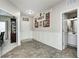 Bright entryway with tile flooring, white wainscoting, and access to multiple rooms at 15178 Silver Charm Dr, Noblesville, IN 46060
