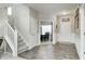 Inviting entryway featuring neutral walls, staircase, and access to the dining area at 15178 Silver Charm Dr, Noblesville, IN 46060