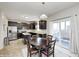 Eat-in kitchen showcasing stainless steel appliances and backyard access at 15178 Silver Charm Dr, Noblesville, IN 46060