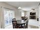 Open concept kitchen and living room area with sliding door access to outdoor patio at 15178 Silver Charm Dr, Noblesville, IN 46060