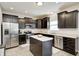 Well-equipped kitchen features stainless steel appliances, granite countertops, and center island at 15178 Silver Charm Dr, Noblesville, IN 46060