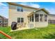 Outdoor patio with a dining set and grill, providing an inviting space for outdoor dining and entertaining at 15178 Silver Charm Dr, Noblesville, IN 46060