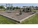 Community playground with multiple play structures and equipment for entertainment at 15178 Silver Charm Dr, Noblesville, IN 46060