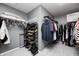 Organized walk-in closet with shelving, clothing racks, and shoe storage for easy access to personal items at 15178 Silver Charm Dr, Noblesville, IN 46060