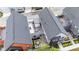 Aerial view showcases a modern home with a private outdoor living space featuring a deck and patio at 1834 Rosette Way, Indianapolis, IN 46202