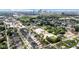 An aerial view of a suburban community with houses, businesses, and a distant skyline at 1834 Rosette Way, Indianapolis, IN 46202