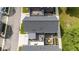 Aerial view showcases the backyard featuring a deck with pergola, and an outdoor dining and patio area at 1834 Rosette Way, Indianapolis, IN 46202