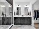 Modern bathroom with dual sinks, stylish black cabinets, and luxurious walk-in glass shower at 1834 Rosette Way, Indianapolis, IN 46202