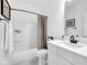 Clean bathroom with shower and tub combination and modern white vanity at 1834 Rosette Way, Indianapolis, IN 46202