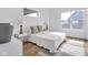 Well-lit bedroom features hardwood floors, neutral decor, and modern lighting fixtures at 1834 Rosette Way, Indianapolis, IN 46202