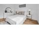 Cozy bedroom with hardwood floors, side tables with lamps, and dresser with mirror at 1834 Rosette Way, Indianapolis, IN 46202