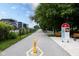 Paved bike path surrounded by lush greenery, perfect for outdoor recreation and exercise at 1834 Rosette Way, Indianapolis, IN 46202