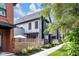 Contemporary two-story home with clean lines and an inviting front yard, showcasing modern design at 1834 Rosette Way, Indianapolis, IN 46202