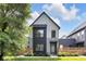 Modern two-story home with gray siding, black accents, and professionally landscaped front yard at 1834 Rosette Way, Indianapolis, IN 46202