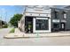 Commercial building with a white brick facade, black trim, and outdoor planters at 1834 Rosette Way, Indianapolis, IN 46202