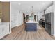 Bright kitchen with stainless appliances, a large island, and open to the living area at 1834 Rosette Way, Indianapolis, IN 46202