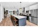Bright kitchen featuring a large island with seating and stainless appliances at 1834 Rosette Way, Indianapolis, IN 46202