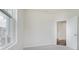 Bedroom with neutral carpeting, white walls, and large windows and an open door at 18955 Seaforth Way, Westfield, IN 46074