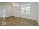 Dining room with wood floors, a chandelier, and a bright window at 18955 Seaforth Way, Westfield, IN 46074