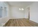 Open dining room features hardwood floors, white walls, and a chandelier at 18955 Seaforth Way, Westfield, IN 46074