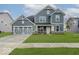Beautiful two-story home featuring a well-manicured lawn, neutral colors, and a two-car garage at 18955 Seaforth Way, Westfield, IN 46074