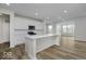 Lovely kitchen with a large center island, stainless steel microwave and oven, and ample white cabinetry at 18955 Seaforth Way, Westfield, IN 46074