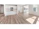 The kitchen has an island, modern appliances, and is seamlessly connected to the living area at 18955 Seaforth Way, Westfield, IN 46074