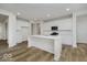 Bright kitchen featuring a large island, modern stainless steel appliances, and beautiful light-colored flooring at 18955 Seaforth Way, Westfield, IN 46074