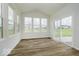 Bright sun room with large windows, light-colored floors, and a sliding glass door with a view at 18955 Seaforth Way, Westfield, IN 46074