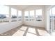 Bright sunroom with large windows offering panoramic views of the surrounding neighborhood at 18955 Seaforth Way, Westfield, IN 46074