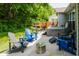 Relaxing backyard patio features a hot tub, seating, and privacy fencing at 18973 Elder Ridge Dr, Noblesville, IN 46062