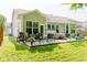 Serene backyard with a hot tub, outdoor seating, and string lights perfect for entertaining at 18973 Elder Ridge Dr, Noblesville, IN 46062